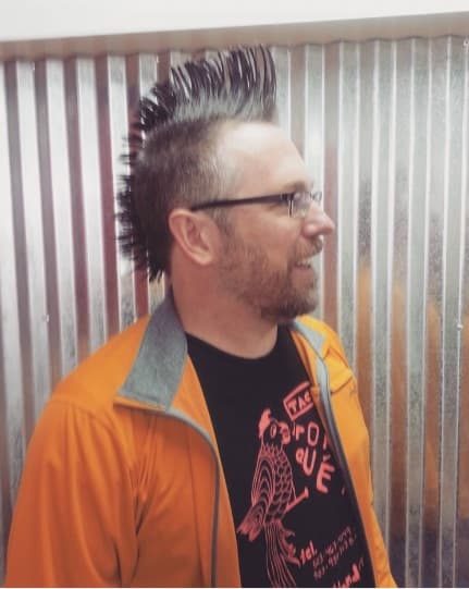 Dark mohawk, cropped sides