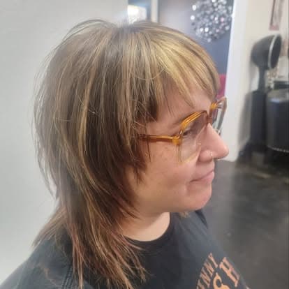 Dark hair with purple highlights in the studio