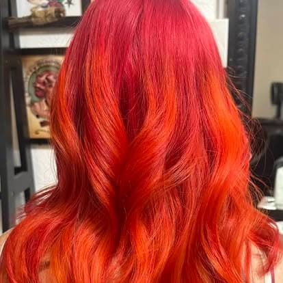 Fiery red-to-orange color on long waves